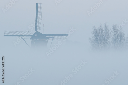 Dutch windmill in the mist