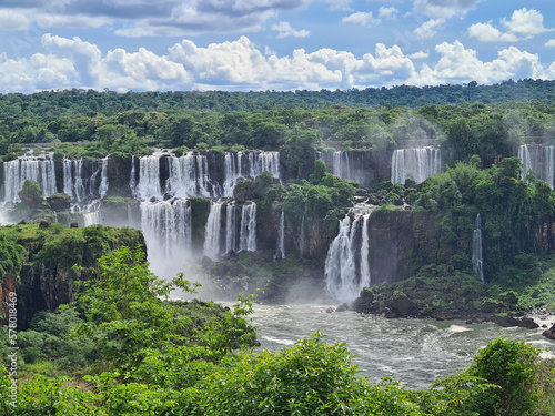 Forest surrounding a cascade of waterfalls in foz do iguacu, one of the 7 natural wonders f the world.