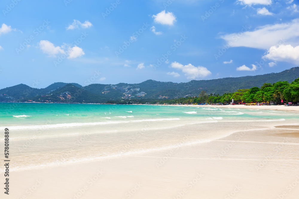 View of beautiful white sand beach with turquoise water of Chaweng beach, in Koh Samui, Thailand.