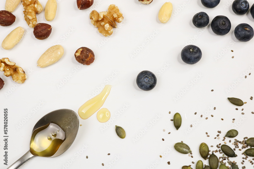 Nuts, seed and fruits on white background Nuts, seed and fruits on white background