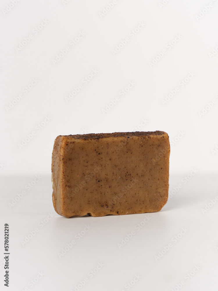 Natural handmade bar soap with coffee on white background Natural handmade bar soap with coffee on white background