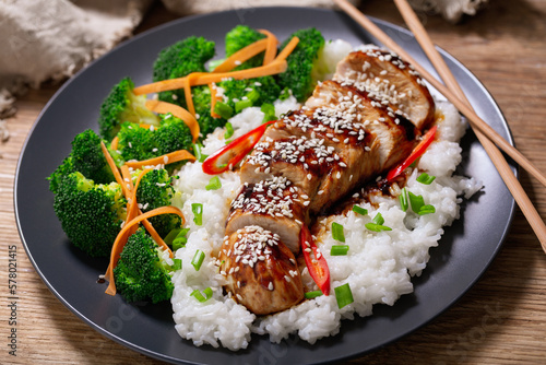 Plate of teriyaki chicken with vegetables and rice