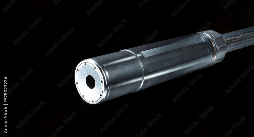 Black silencer mounted on a rifle barrel