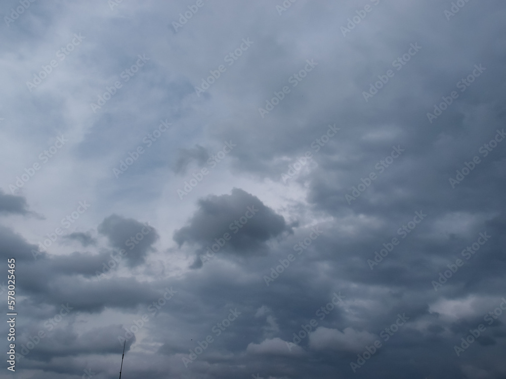 Cloudy sky with gray clouds, dark stormy clouds. Dramatic thunder clouds grey overcast. For background, wallpaper, digital artwork use and etc.. Cloudy sky with gray clouds, dark stormy clouds. Dramatic thunder clouds grey overcast. For background, wallpaper, digital artwork use and etc..