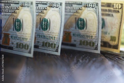 Money, US dollar bills background. Money scattered on the desk. Photography for Finance and Economy concepts. photo