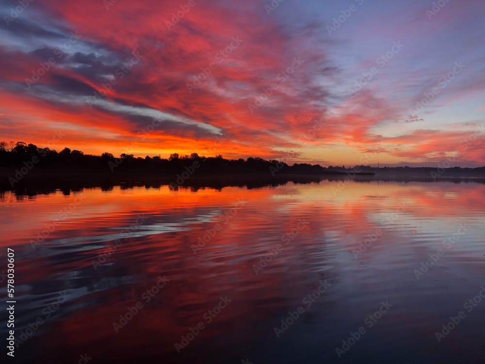 Sunrise over a quiet lake