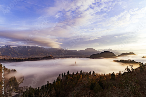 Fototapeta Naklejka Na Ścianę i Meble -  Lake Bled in Fog with a rising sun