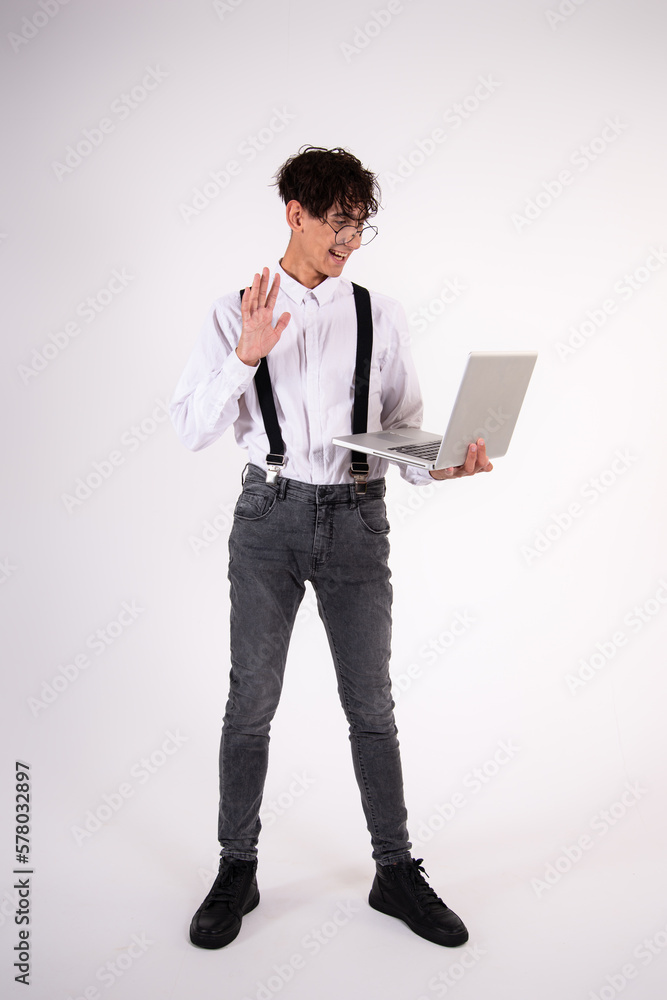 Funny young man with a laptop. White background. Funny young man with a laptop. White background.
