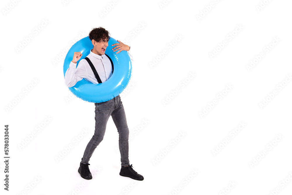 Funny man with an inflatable ring. The guy dreams of a vacation. White background. Funny man with an inflatable ring. The guy dreams of a vacation. White background.