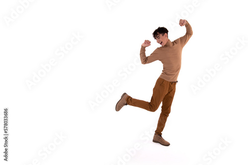 Cheerful attractive young man. The guy dreams of a vacation. White background.