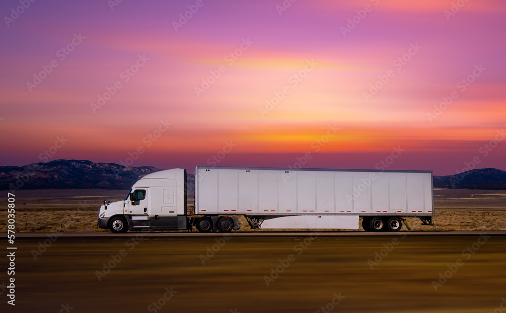 Semi Trucks on the Nevada Highway at twilight sky, USA. Trucking in Utah