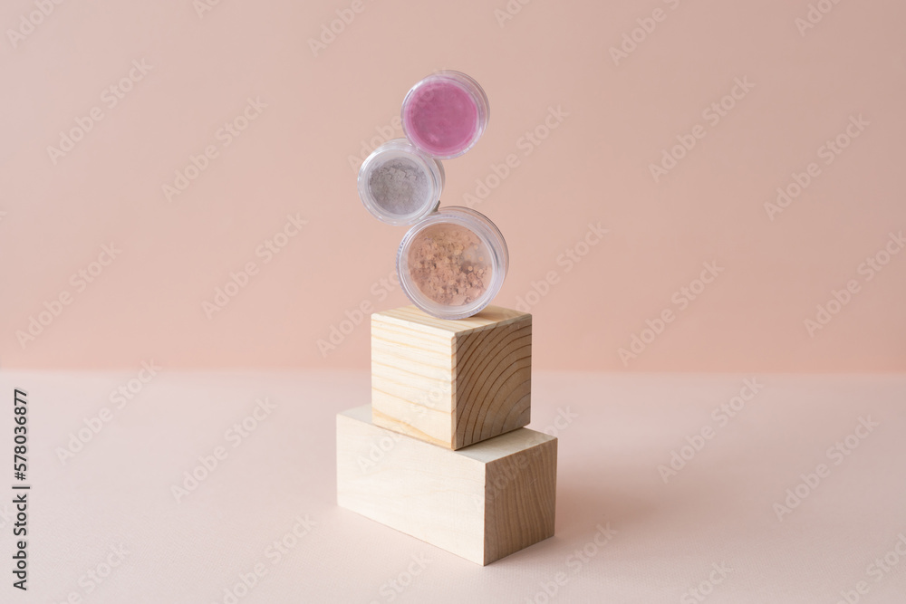 Makeup mineral eco face powder products on pastel background. Eco friendly cosmetics. Eyeshadows and blush Makeup mineral eco face powder products on pastel background. Eco friendly cosmetics. Eyeshadows and blush
