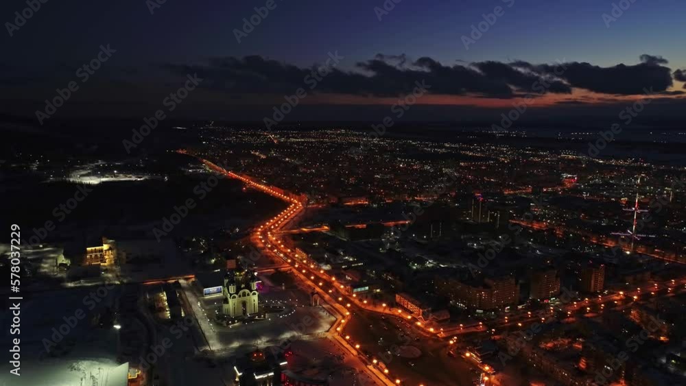 Flight over the illuminated city at night. Drone shot of night cityscape. Flight over the illuminated city at night. Drone shot of night cityscape.