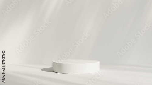 Fotografia Abstract white room with realistic white cylinder pedestal podium set and leaf shadow overlay