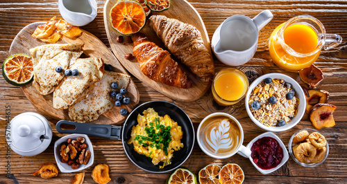 Breakfast served with coffee, eggs, cereals nd croissants