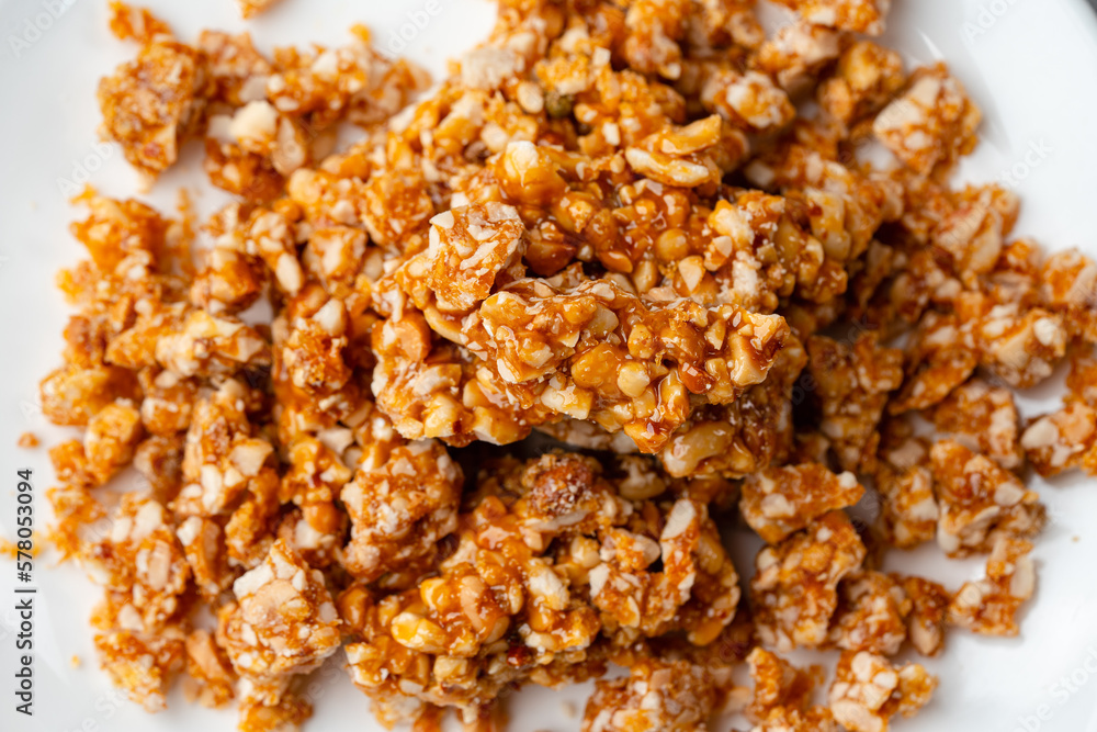Crushed caramel peanut brittle is usually used for topping cakes. Nougat Caramel Crushed caramel peanut brittle is usually used for topping cakes. Nougat Caramel