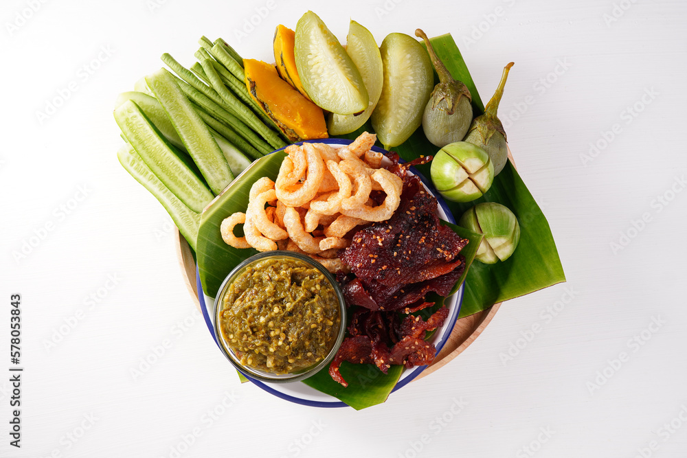 Chili paste, fried pork, fried pork skin and fresh vegetables. Thai style menu Nam Prik Num (Northern Thai Green Chilli Dip)
