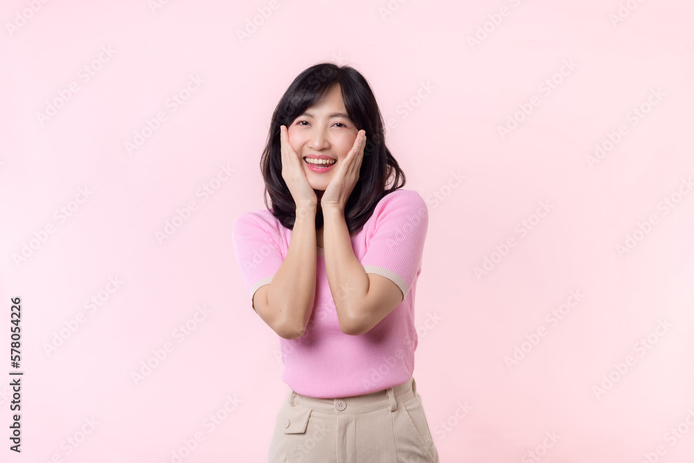Portrait beautiful young asian woman model happy smile in pink sweater casual style fashion isolated on pink studio background. Attractive female person cheerful cute face portrait, Woman day concept. Portrait beautiful young asian woman model happy smile in pink sweater casual style fashion isolated on pink studio background. Attractive female person cheerful cute face portrait, Woman day concept.