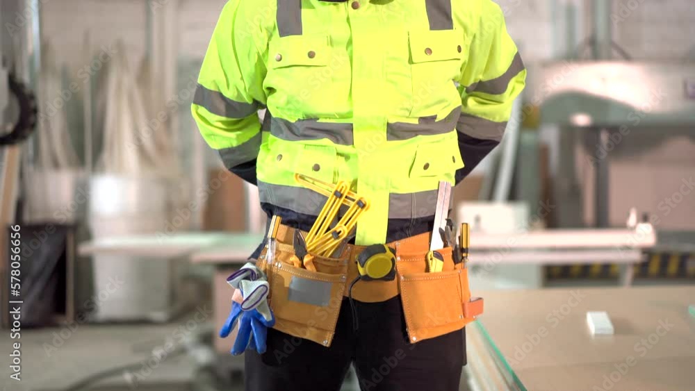 Professional factory engineer get dressed with an equipments or tools before getting to work. Mechanical engineer attach a tools pouch. Professional factory engineer get dressed with an equipments or tools before getting to work. Mechanical engineer attach a tools pouch.