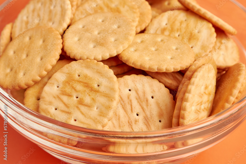 A bowl of round cookies on a yellow background. A tasty and sweet snack. A bowl of round cookies on a yellow background. A tasty and sweet snack.