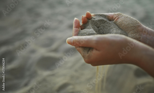 Fotografie Sand slips through your fingers. Time is fleeting.