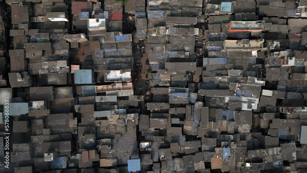 Top down aerial view descending over the Dharavi slums in Mumbai, Maharashtra, India. Dharavi is considered to be one of the largest slums in the world and the largest in Asia. Top down aerial view descending over the Dharavi slums in Mumbai, Maharashtra, India. Dharavi is considered to be one of the largest slums in the world and the largest in Asia.