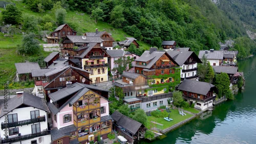 Top view of Hallstatt village houses, mountains background in Austria Stock drone video Top view of Hallstatt village houses, mountains background in Austria Stock drone video
