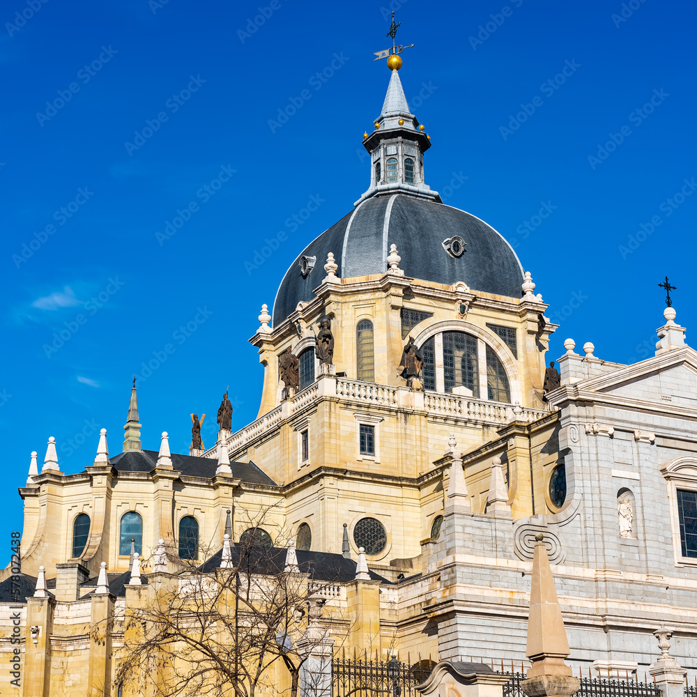 Cupula and annexed constructions of the Almudena Cathedral on its back in the city of Madrid, Spain.