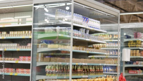 Wallpaper Mural Close-up of a supermarket shopping trolley and a buyer picks it up and rolls it Torontodigital.ca