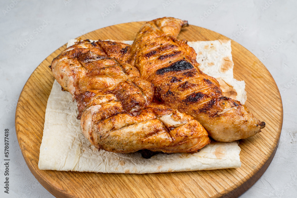 Grilled chicken on a cutting board Grilled chicken on a cutting board