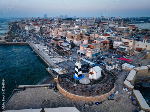 Acre (Akko) is a port city located on the Mediterranean coast and is known for its well-preserved ancient city fortifications. .Aerial footage of the old city, the ancient port and marina.