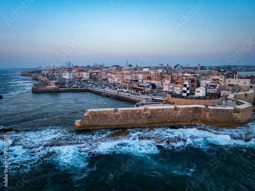 Acre (Akko) is a port city located on the Mediterranean coast and is known for its well-preserved ancient city fortifications. .Aerial footage of the old city, the ancient port and marina.