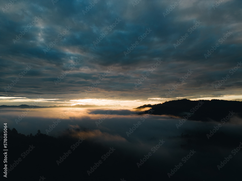 Mountain range and mist with sky and sunrise and surrounding area. Mountain range and mist with sky and sunrise and surrounding area.