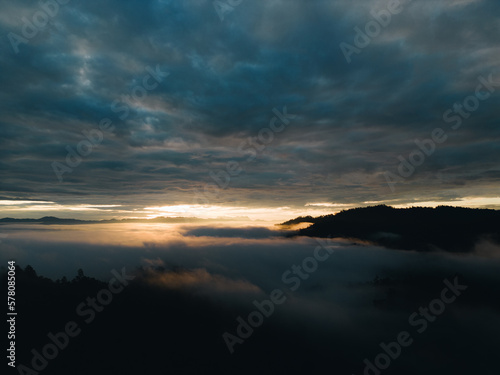 Mountain range and mist with sky and sunrise and surrounding area. © Sarawin