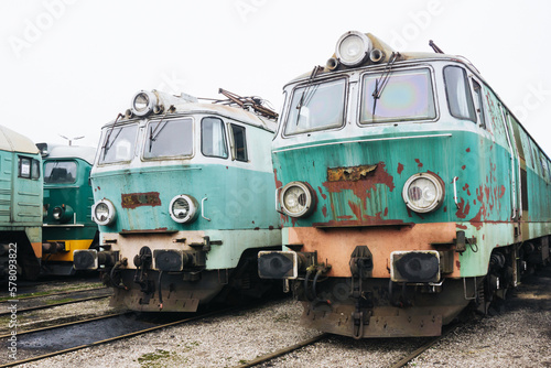 Rusty train. Old grunge trains. Abandoned heavy machines. Railway siding landscape. Scrapyard of trains.