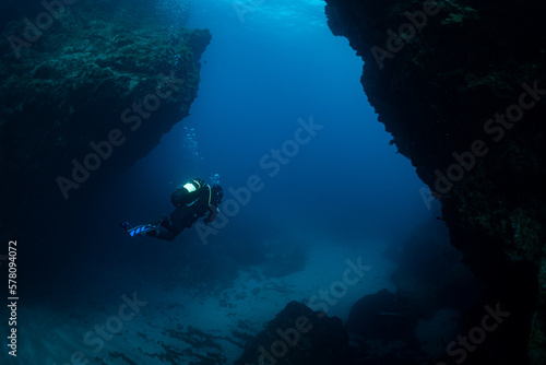Female Scuba diver diving in the Canary Islands in Tenerife at Cala Amarilla