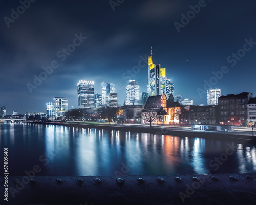 Beautiful blue view of Frankfurt skyline at night from a bridge - Frankfurt, Germany