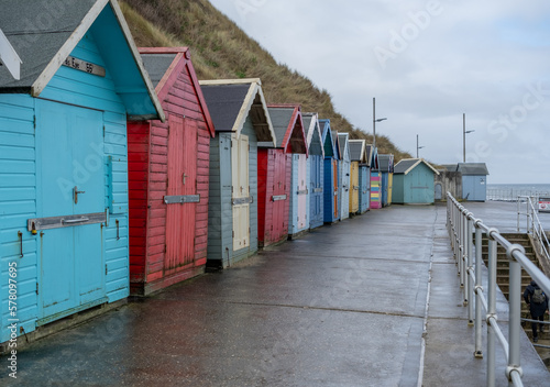 Colourful beach huts along the promenade in the seaside town of Sheringham on the North Norfolk coast