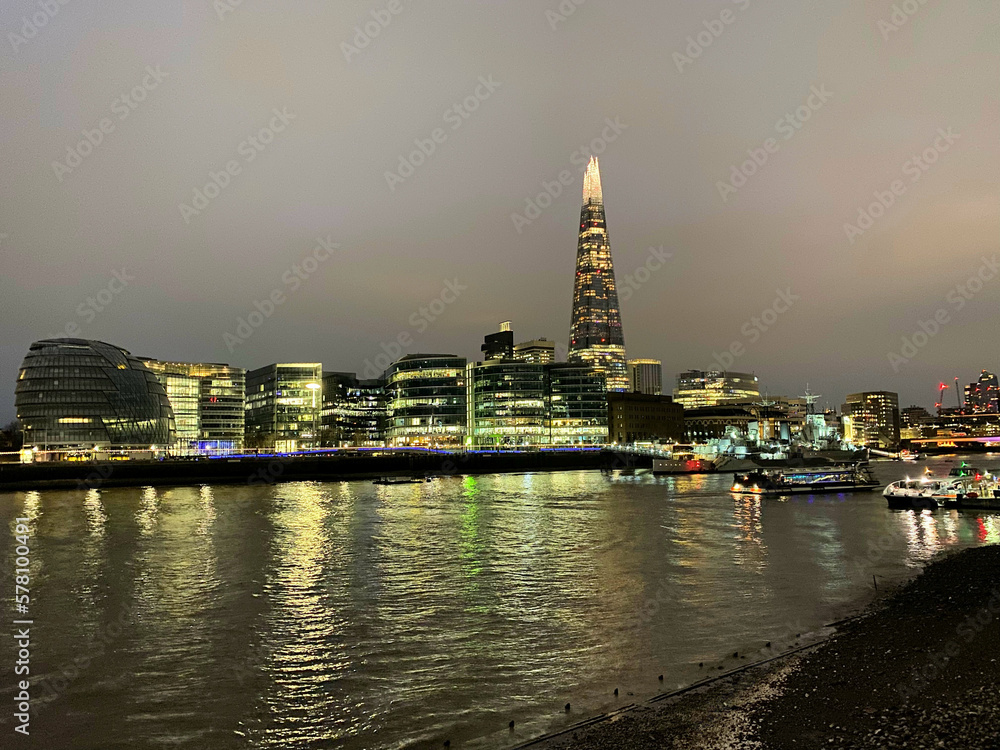 The River Thames at night showing a reflection