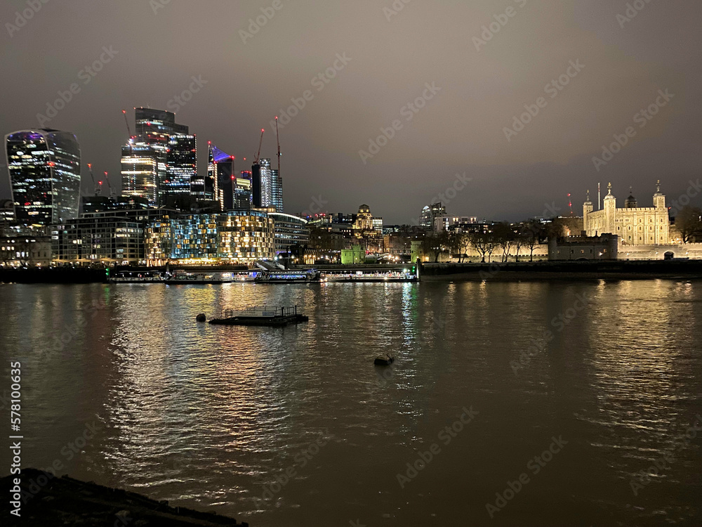 The River Thames at night showing a reflection