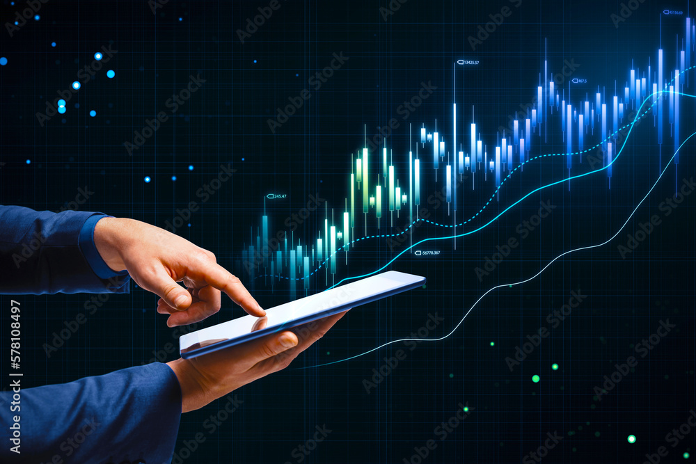 Online trading, investing and stock market concept with man finger on digital tablet touch screen and glowing rising financial chart candlestick and diagram on dark technological background - obrazy, fototapety, plakaty 