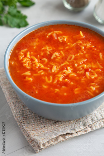 Homemade Alphabet Soup in Tomato Sauce in a Bowl, side view.