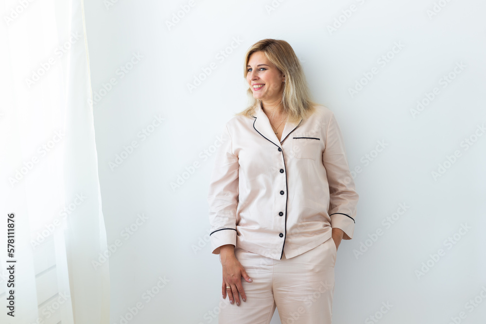 Cute female model in pajama enjoying morning. Pleasant woman copy space. Good mood Cute female model in pajama enjoying morning. Pleasant woman copy space. Good mood