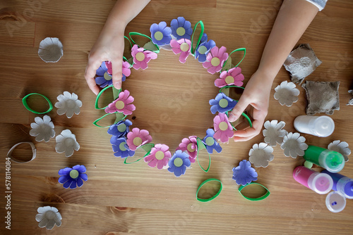 DIY project with kids, an egg carton is transformed into Easter flower wreath. Creativity and sustainability that come with a Zero Waste lifestyle. Reduce, reuse, and recycle photo