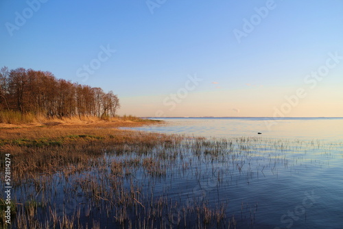 lake golden hour   autumn landscape  yellow forest blue calm smooth water