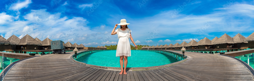 Woman standing on the wooden pier