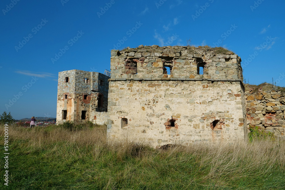 Ancient stone towers in Pniv Castle - medieval historical object, Ukraine Ancient stone towers in Pniv Castle - medieval historical object, Ukraine