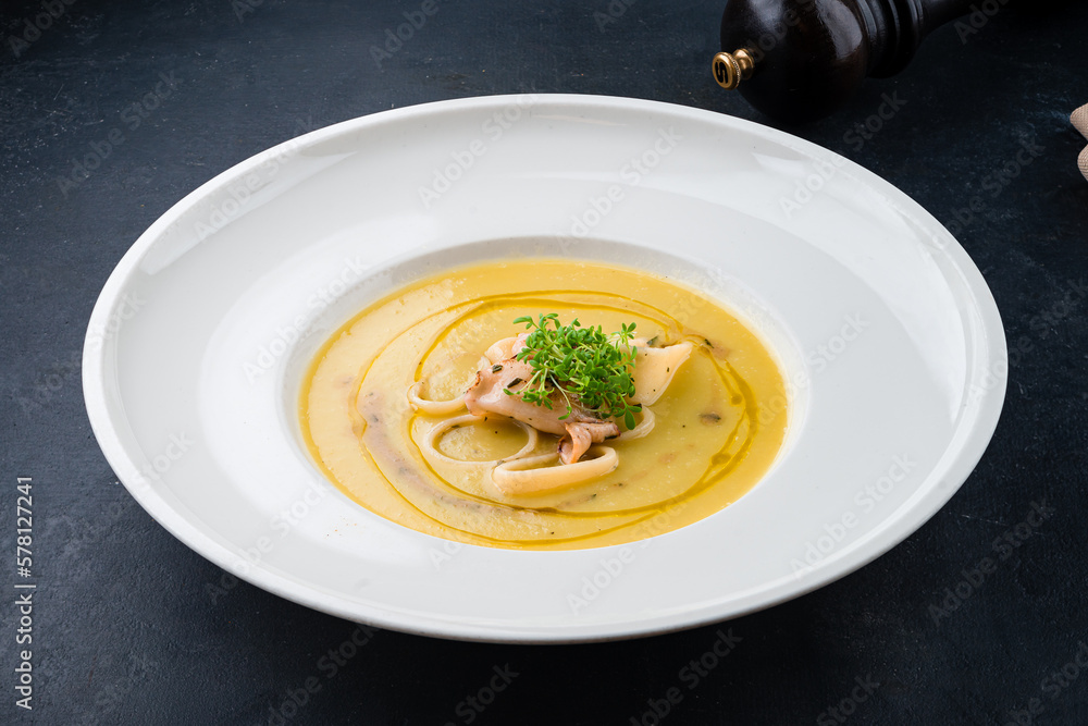 Lunch potato cream soup with squid, octopus and microgreens. Lunch potato cream soup with squid, octopus and microgreens.