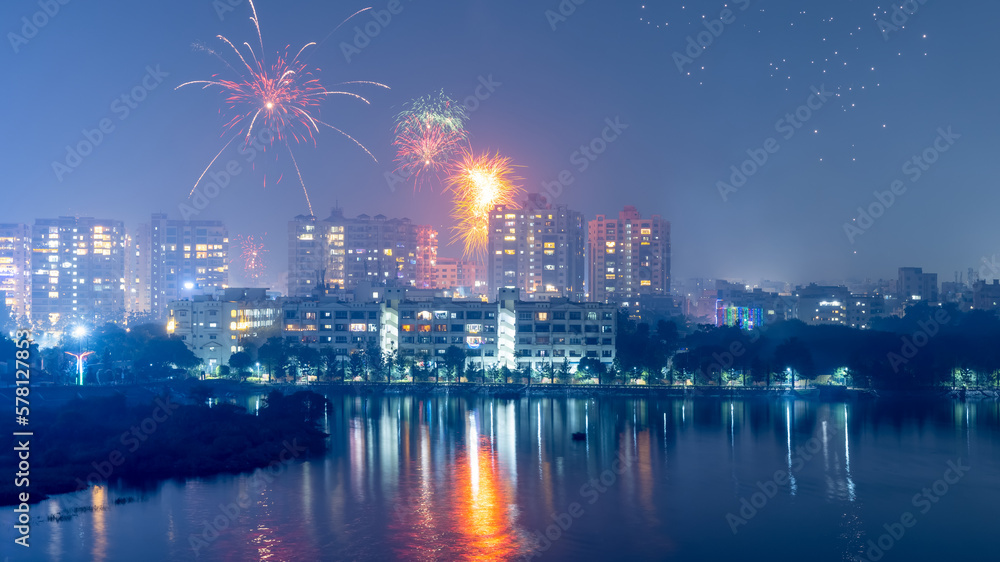 Hyderabad cityscape in Telangana, India. illuminated with Diwali festival fireworks. - obrazy, fototapety, plakaty 