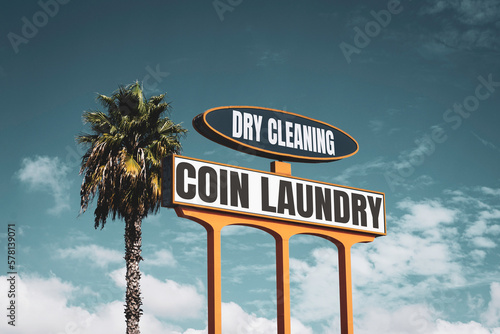 Vintage coin laundry and dry cleaning sign